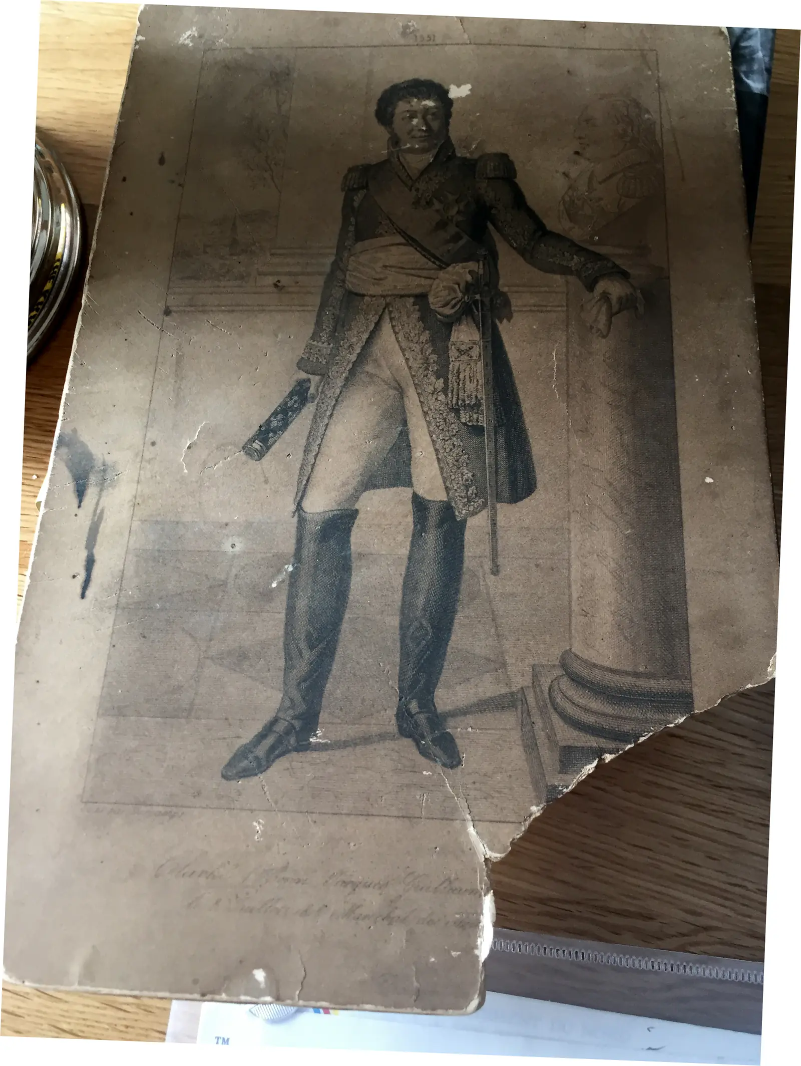 Worn full-length military portrait print with a standing uniformed man, baton, sword and damaged lower-right corner